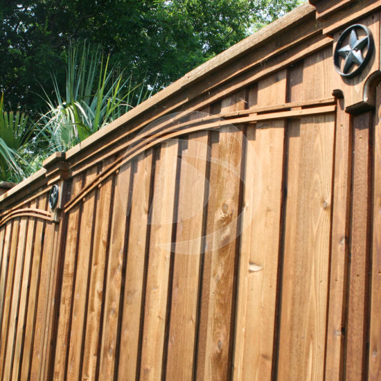 Side view of board on board cedar fence with ornament fence accents