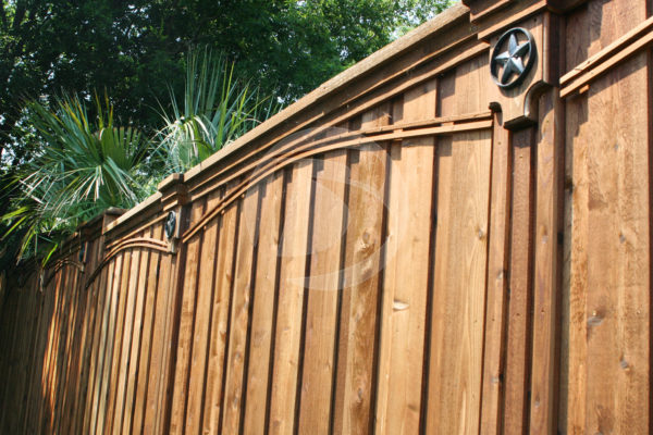 Side view of board on board cedar fence with ornament fence accents