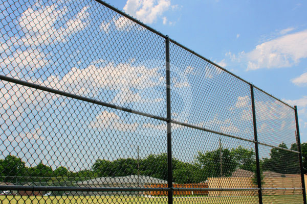 Vinyl black coated chain link fence surrounding a baseball field.