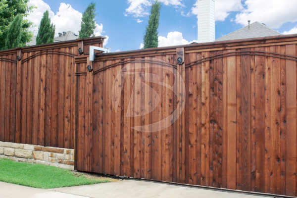 Stained Knotty cedar fence including access controls swing gate system with ornamental accents