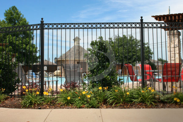 Ornamental Residential Fence panel with Decorative Rings around Community Pool