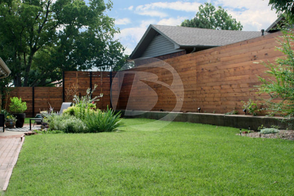Horizontal cedar wood stained backyard fence
