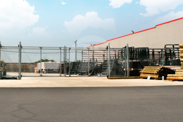 Double Cantilever access controls gate with chain link for a business entrance