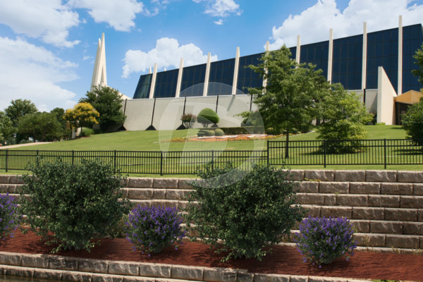 Black ornamental commercial fence panels around a corporate campus