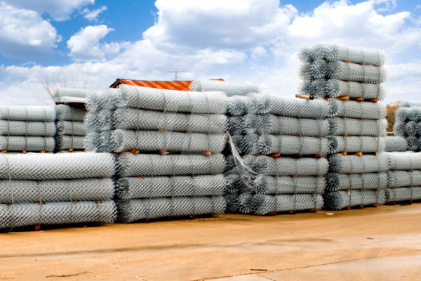 Bundled chain link fencing in fence supply yard