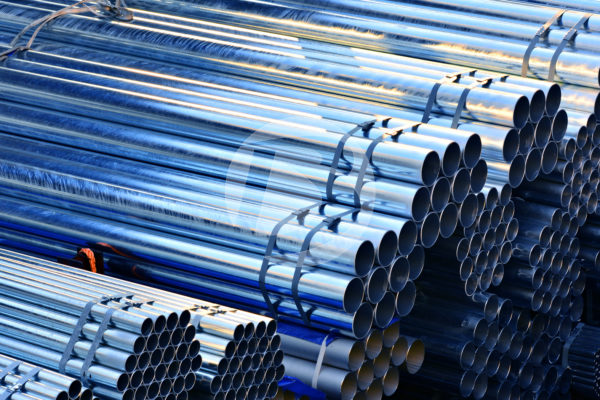 Stacks of galvanized posts, bundled together for distribution