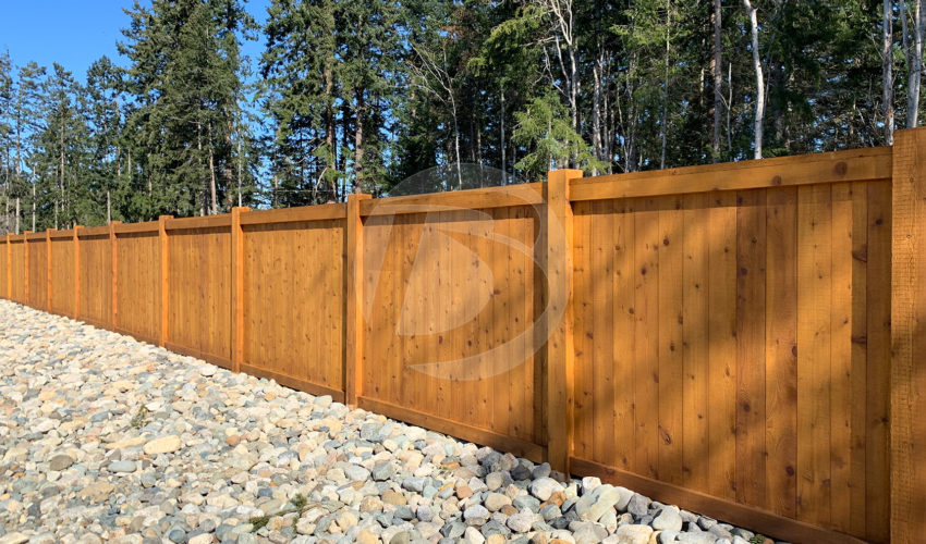 Cedar fence with cedar post 8 foot tall along shoreline