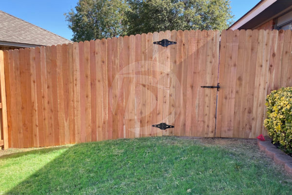 Natural cedar wood fence and gate with metal gate fittings