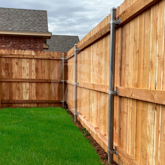 Cedar wood fence with galvanized post and fittings includes top cap and wood rails
