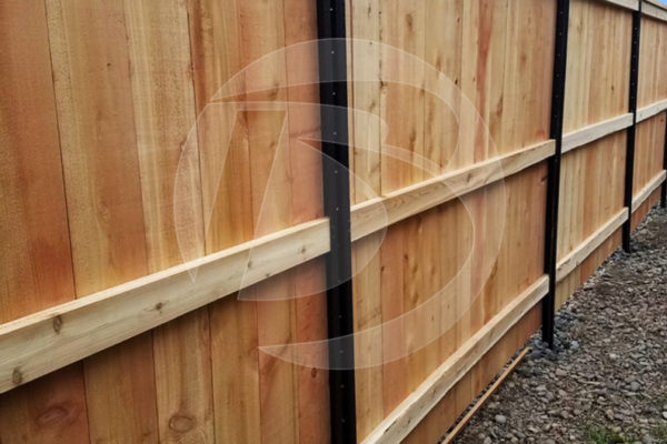 Lifetime Steel Post back side of wood fence close up