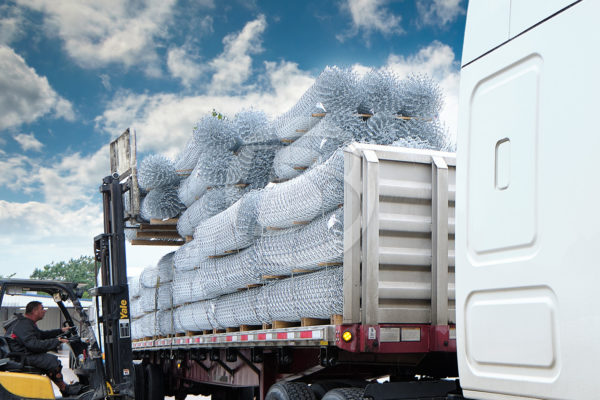 Truck of Chain Link Fencing being Unloaded