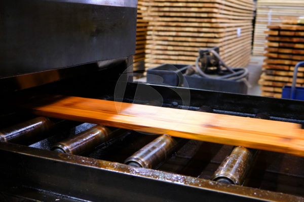 Wood Dimension Lumber being Oil Stained