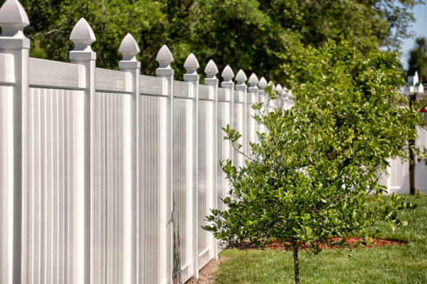 Gothic top side by side white vinyl fence with vinyl top cap.