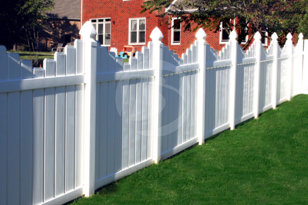 White Scallop top vinyl fence with staggered posts and white rails